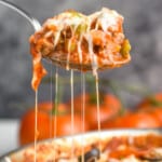 pinterest graphic showing serving spoon pulling up a scoop of pizza casserole, with cheese hanging down