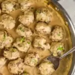 pinterest graphic of overhead of a pan of swedish meatballs in sauce garnished with parsley