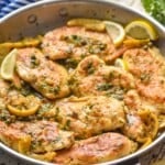 side view of a skillet full of easy chicken piccata - 12