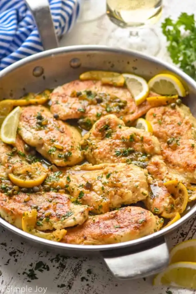 side view of a skillet full of easy chicken piccata