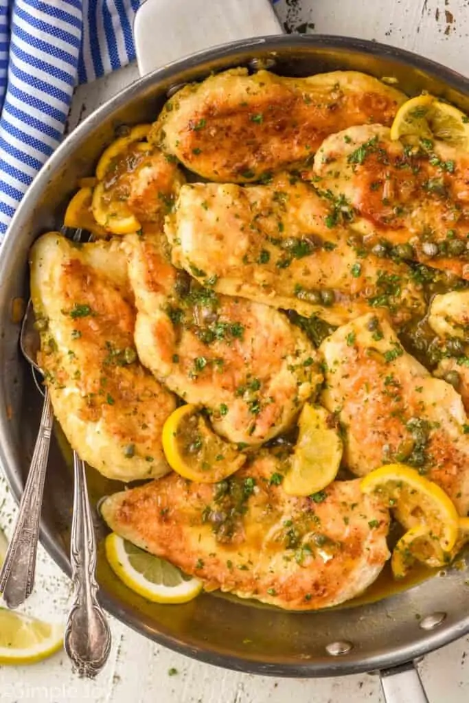 overhead view of a skillet full of chicken piccata