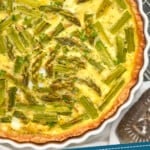 pinterest graphic of close up overhead photo of an asparagus quiche recipe