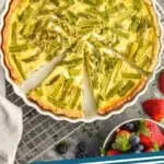 pinterest graphic of overhead picture of an asparagus quiche that has pieces cut out