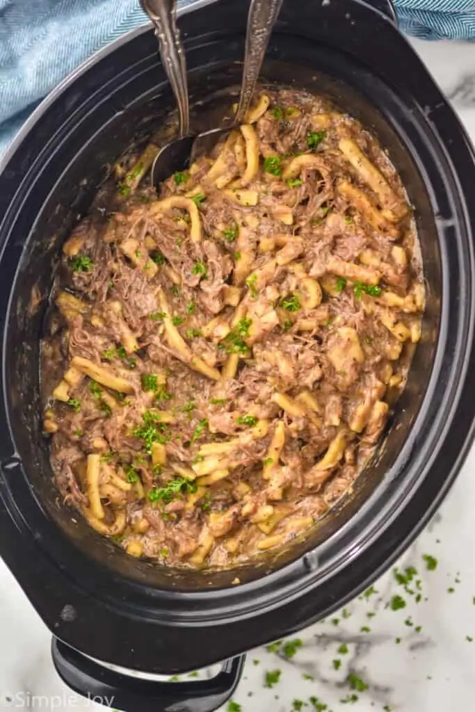 overhead view of crock pot beef and noodles