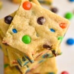 overhead view of a stack of cookie bars with m&ms in them - 9