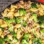 overhead view of a skillet full of sausage pasta