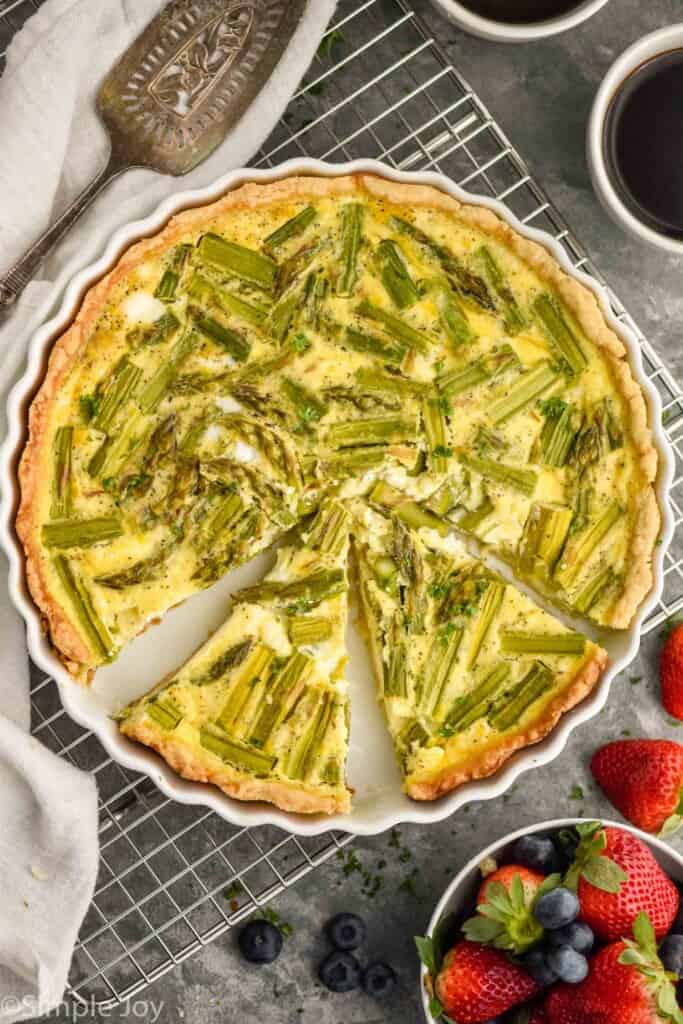 overhead picture of an asparagus quiche that has pieces cut out