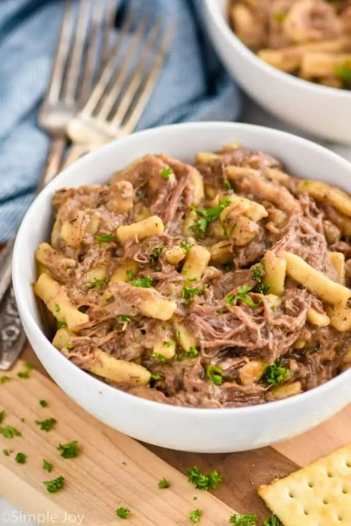 close up side view of a bowl of crockpot beef and noodles