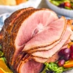 whole honey baked ham on a platter