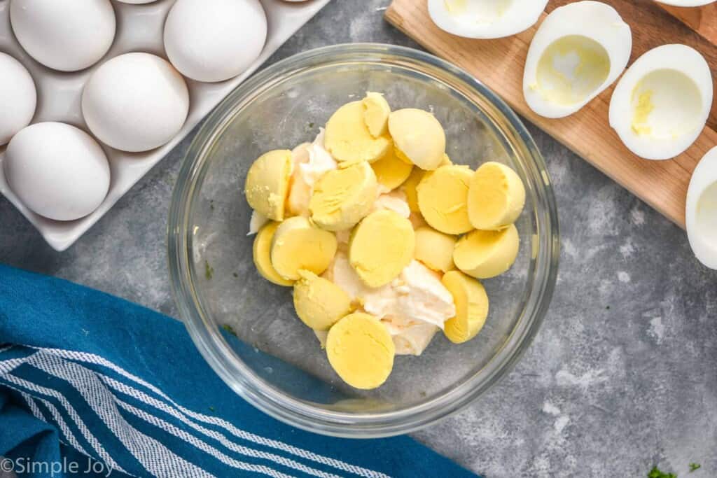 overhead photo of a bowl of egg yolks and mayonnaise