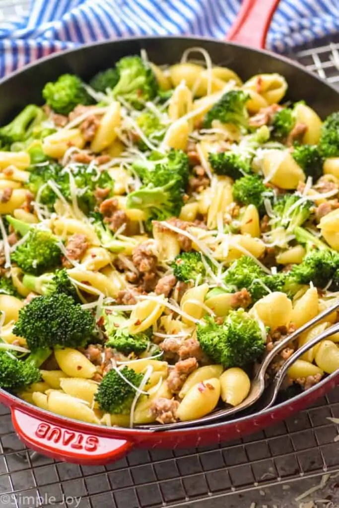 side view of Italian sausage pasta with parmesan and red pepper flakes