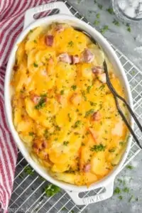 overhead view of a casserole dish with scalloped potatoes and ham