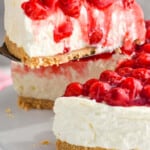 pinterest graphic of piece of cherry cheesecake being lifted out of a cheesecake