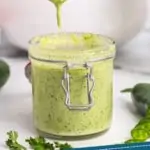 pinterest graphic of a small jar of jalapeno ranch dressing with a spoon dripping more over it