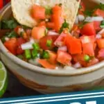 a tortilla chip being dipped into Pico de Gallo