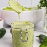 a small jar of jalapeno ranch dressing with a spoon dripping more over it - 8