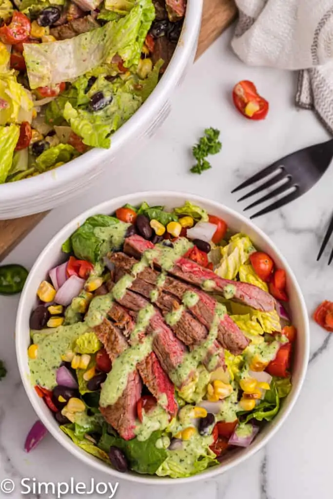 overhead of a southwestern steak salad with jalapeno ranch dressing