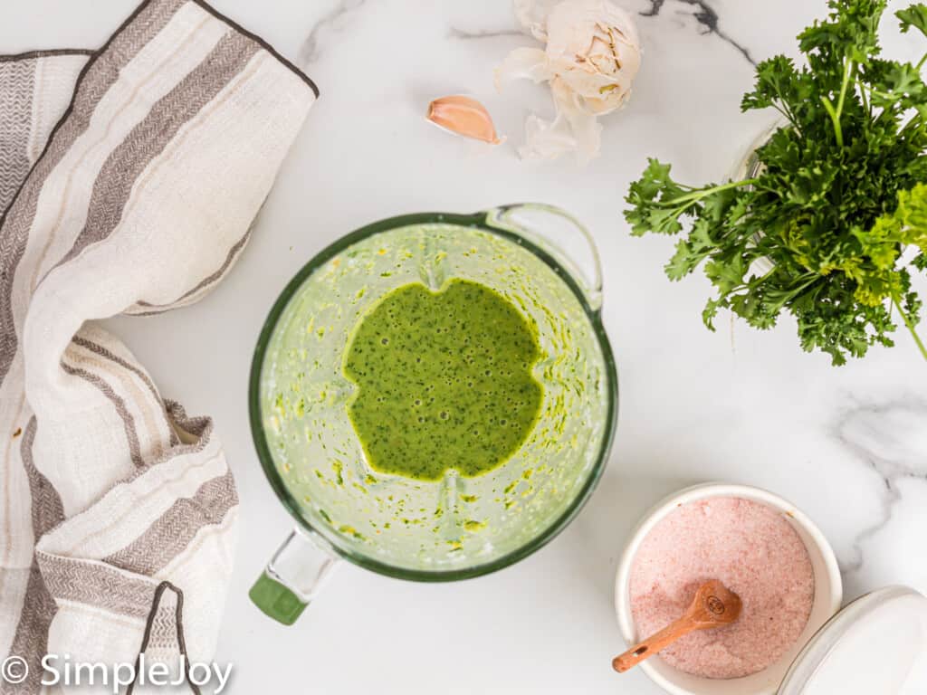 overhead of a blender that has blended up jalapeno ranch dressing