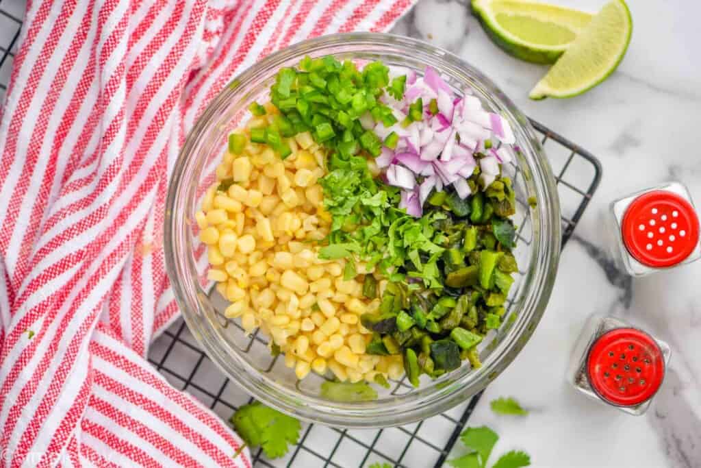 chipotle corn salsa ingredients broken down by ingredients in a bowl