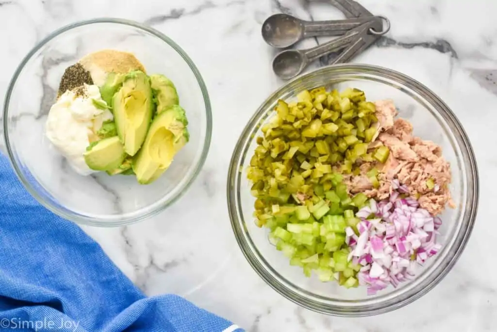 two bowls, one with ingredients for tuna salad, one with ingredients for the dressing