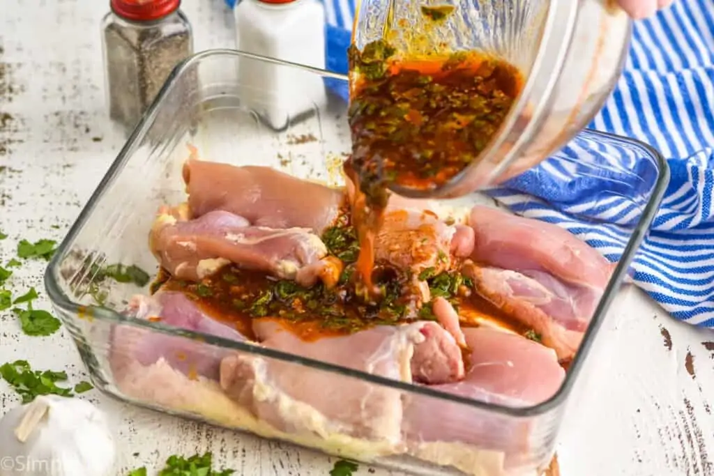 street taco marinade being poured over chicken thighs