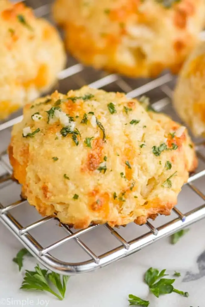 a red lobster cheddar bay biscuit on a cooling rack