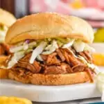 pinterest graphic of bbq pulled pork on a bun with coleslaw