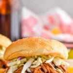 pinterest graphic of bbq pulled pork on a bun with coleslaw