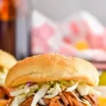 pinterest graphic of bbq pulled pork on a bun with coleslaw