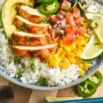 pinterest graphic of a burrito bowl recipe with chicken, cilantro lime rice, corn, avocado, Pico de Gallo, beans, and fresh jalapeños