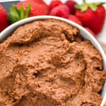 pinterest graphic of close up overhead of a bowl of chocolate hummus recipe
