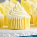pinterest graphic of up close picture of lemon cupcakes topped with frosting swirl and a lemon wedge