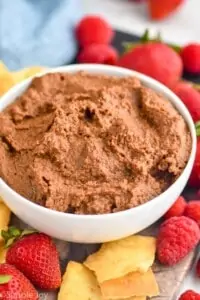 a white bowl filled with chocolate hummus