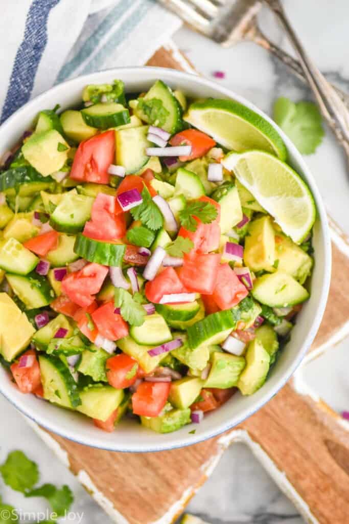 overhead of a cucumber avocado salad