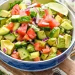 bowl full of cucumber tomato avocado salad