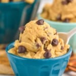 a close up of edible cookie dough recipe in a small blue bowl