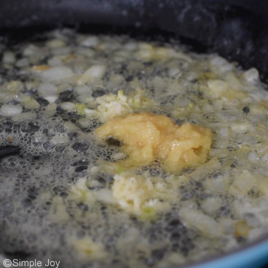 ginger and garlic in a skillet with butter and onions