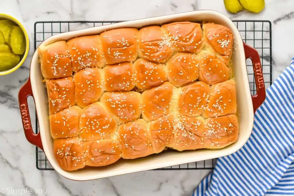 overhead of a baking dish that has cheeseburger sliders recipe