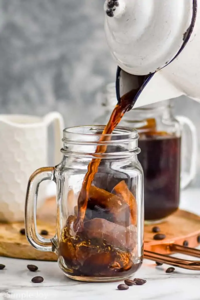 coffee being poured over coffee ice cubes