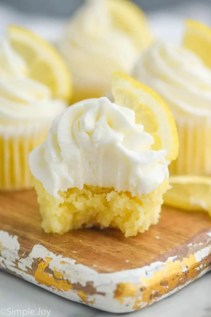close up of a lemon cupcake that has been bit into