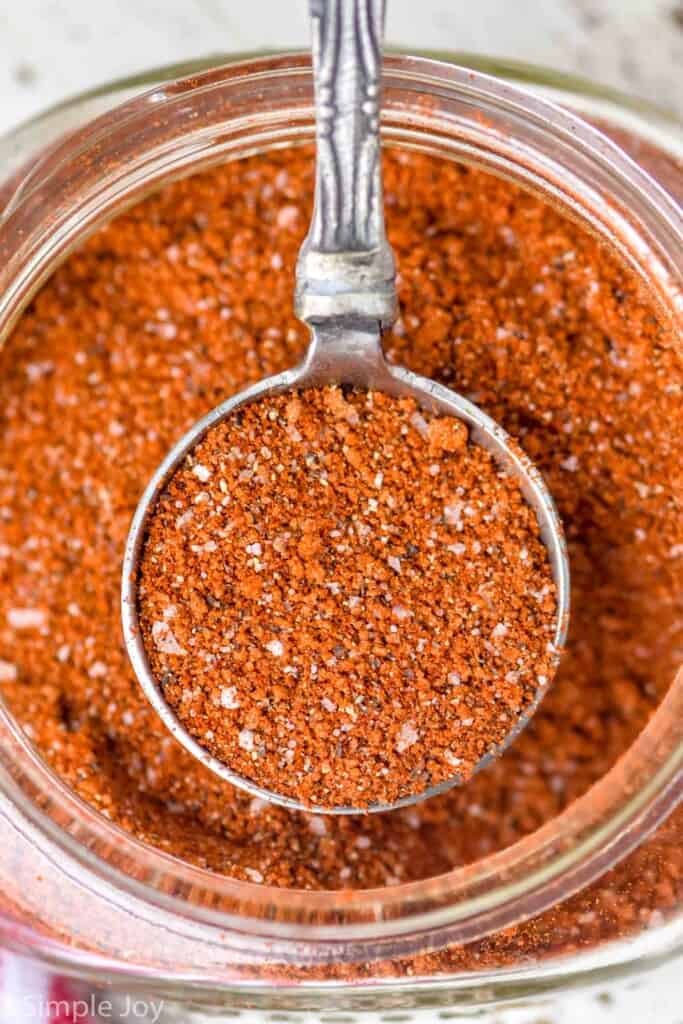 close up of a tablespoon full of pulled pork rub