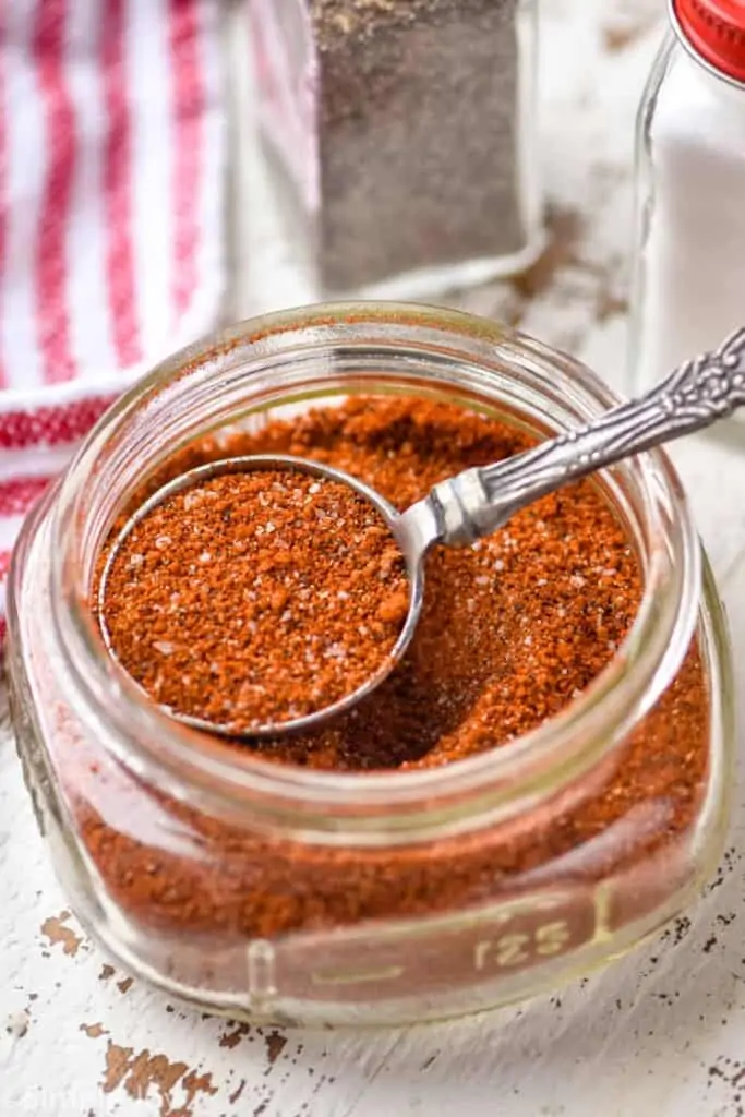 a small mason jar full of pork rub recipe