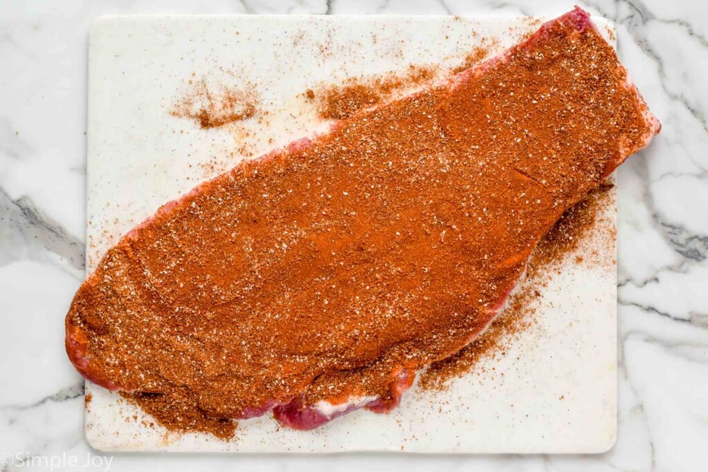 uncooked pork ribs that have been seasoned with pork rub