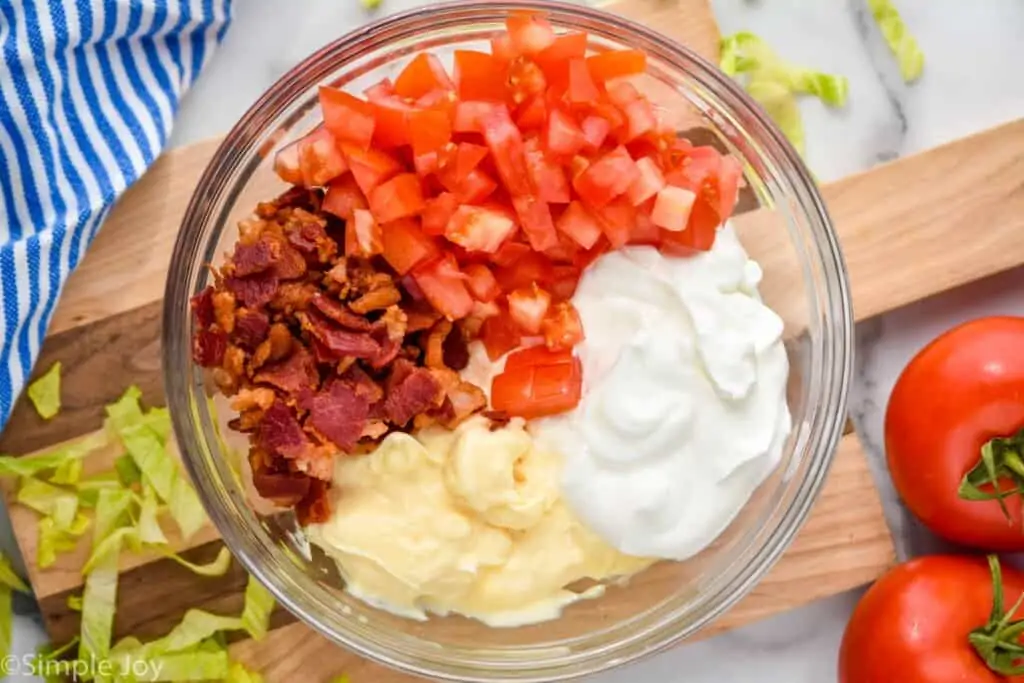 overhead of ingredients for blt dip in a bowl