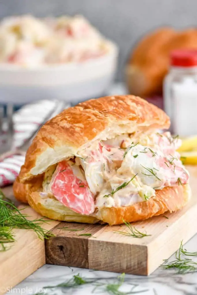 crab salad sandwich on a cutting board