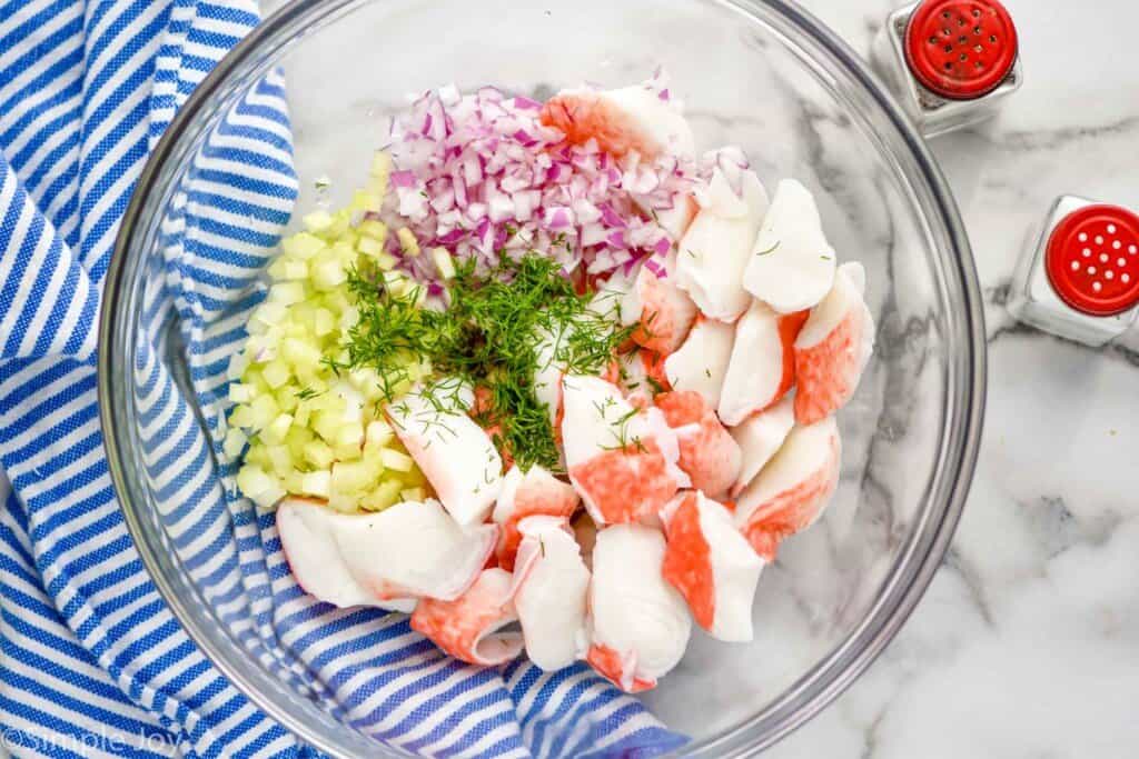 overhead of ingredients for crab salad in a bowl