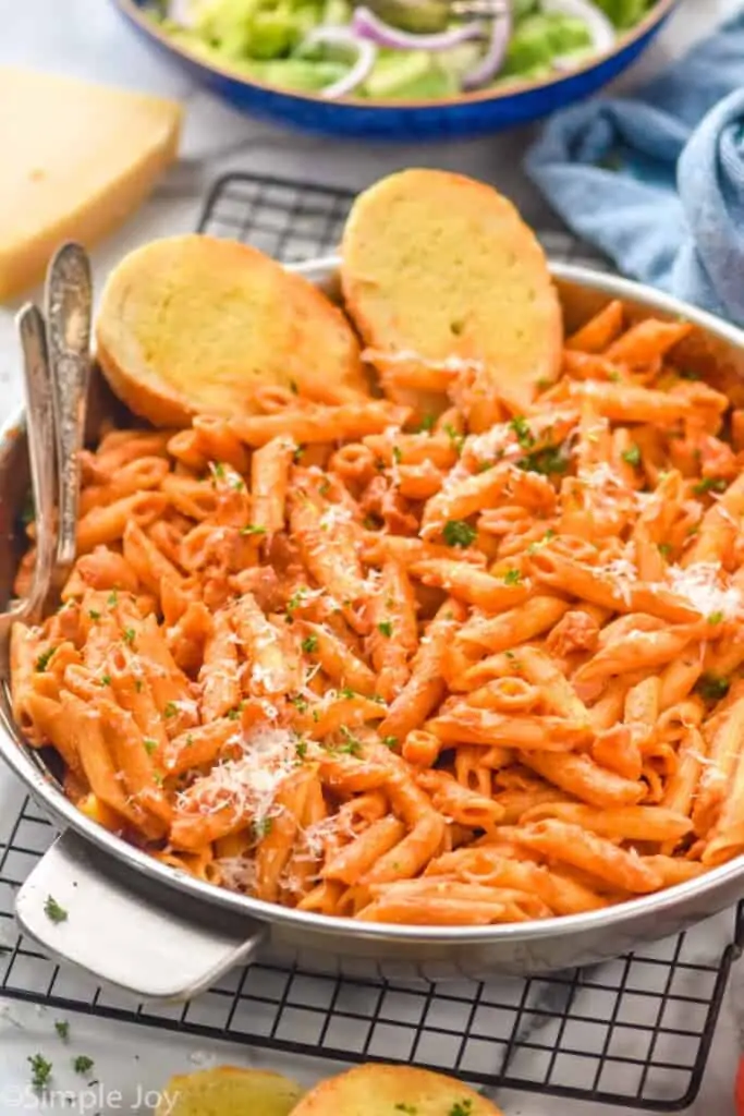 side view of a skillet full of penne Alla vodka