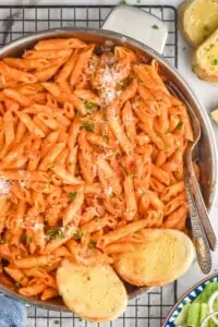 overhead ove a skillet full of penne Alla vodka recipe