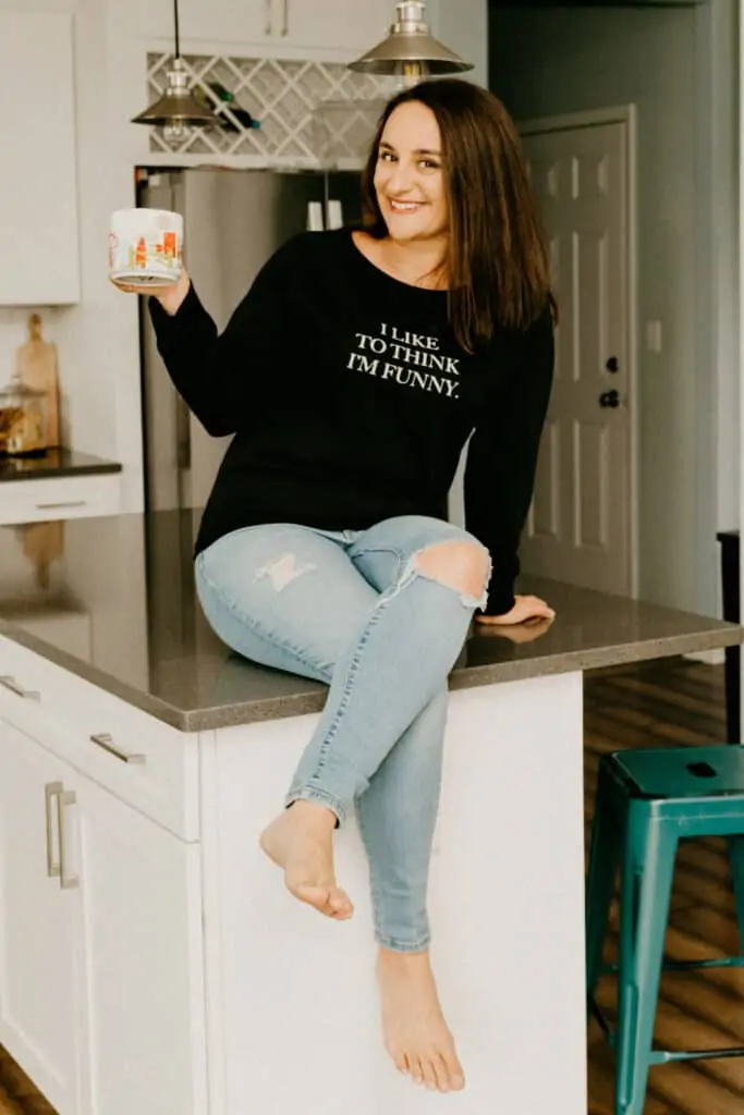 woman in a black sweatshirt that says "I like to think I'm funny"