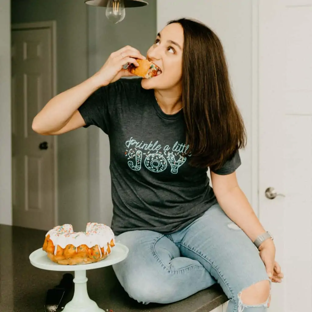 woman in a t-shirt that says "sprinkle a little joy"